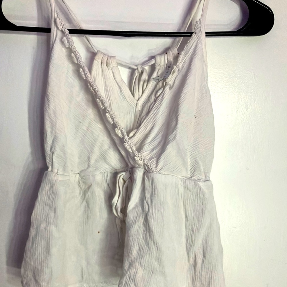 White cute summer shirt has 2 holes and one little non noticeable stain